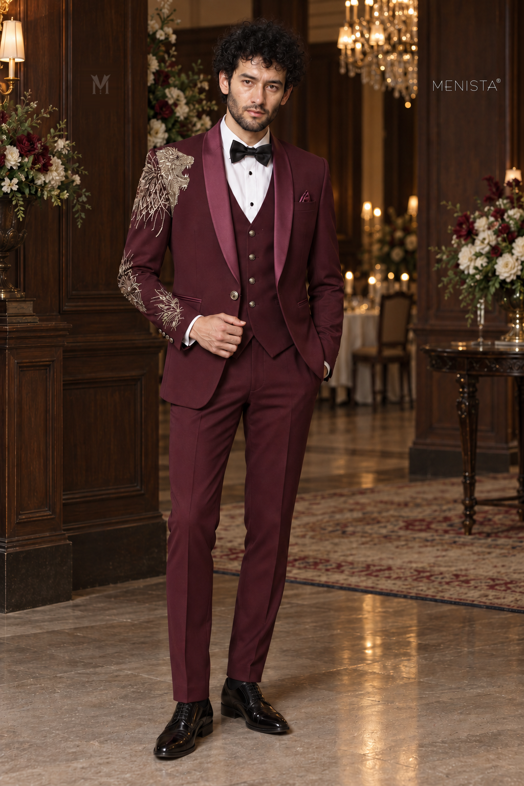 Michael wearing Leonis burgundy lion embroidered three-piece tuxedo, full-length front view