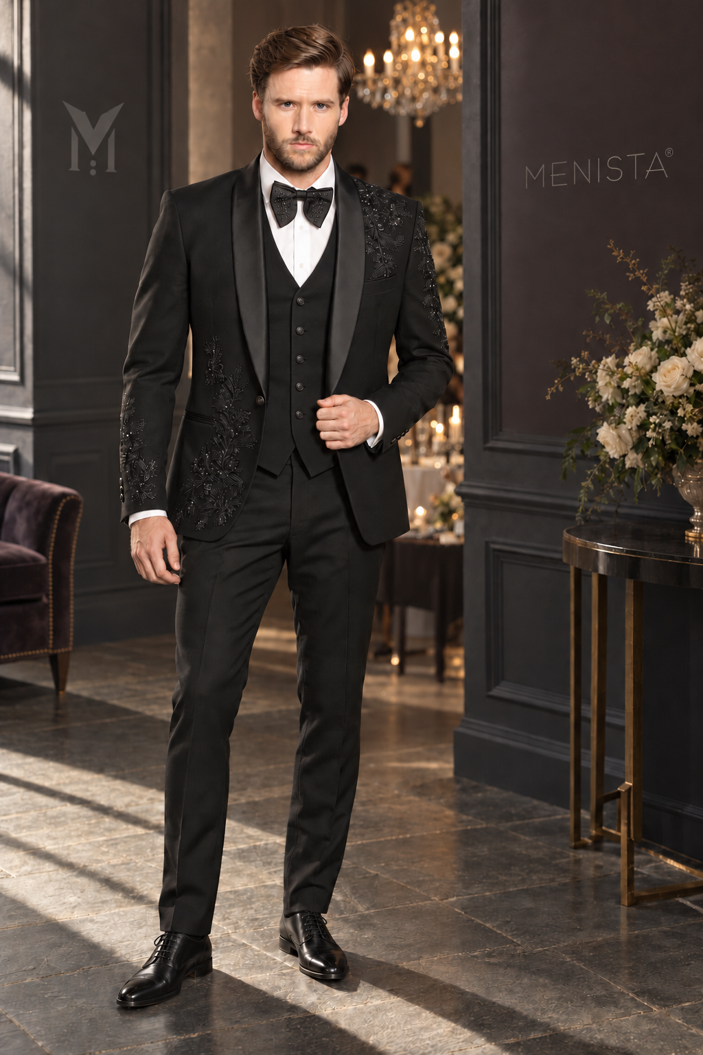 Jack wearing Lucien black tonal floral embroidered three-piece tuxedo, full front view with a simple five-button waistcoat.