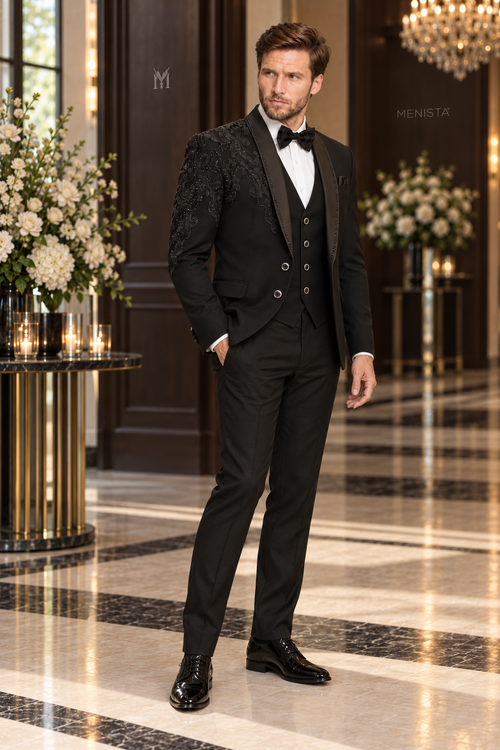 Three-quarter view of Alder black tuxedo with asymmetric paisley bead embroidery