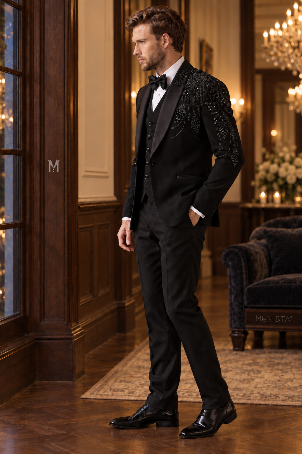 Three-quarter view of Aurel black floral embroidered tuxedo showing shoulder beadwork, satin shawl lapels and tailored silhouette.