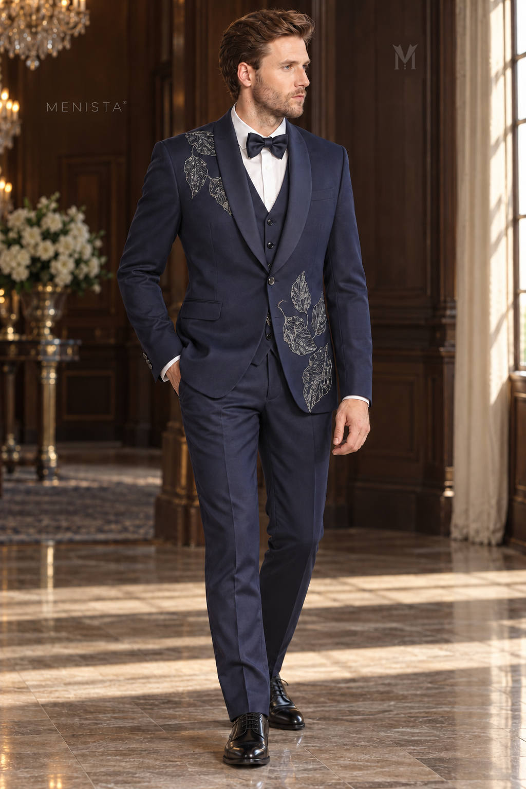 Three-quarter view of Menista Sylvan navy leaf embroidered tuxedo showing one-button jacket, simple waistcoat and matching trousers.