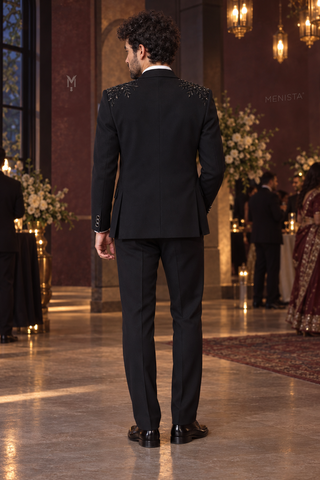 Full back view of Cyran Black Botanical Beaded 3PC Tuxedo with plain trousers and side vents.