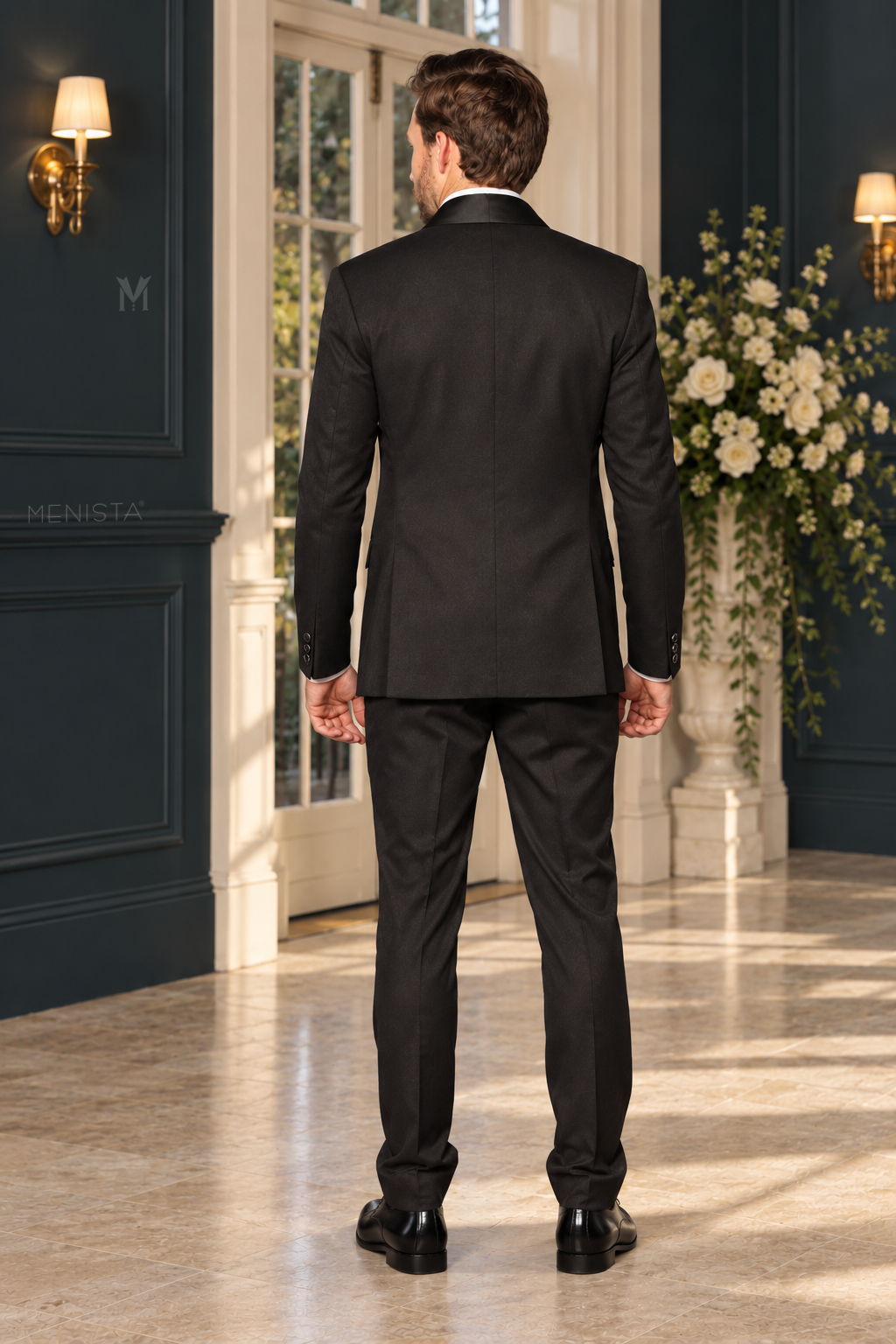 Full back view of Dorian black tuxedo showing plain jacket back, two side vents, matching trousers and natural slim fit.