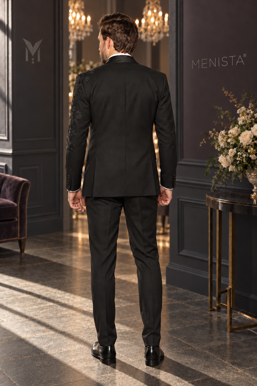 Full back view of Lucien black tuxedo with plain centre seam, two side vents and matching trousers.