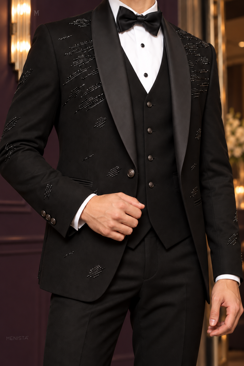 Noctis close-up showing gunmetal bead embroidery, satin shawl lapels, single jacket button and four-button waistcoat.