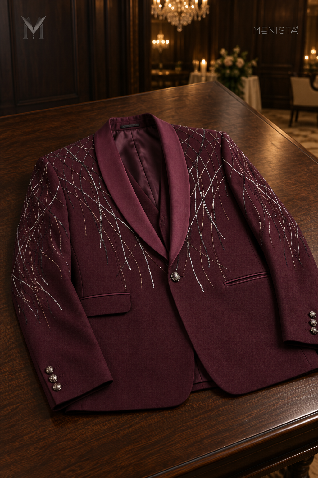 Vesper one-button burgundy geometric embroidered jacket laid flat on a wooden table